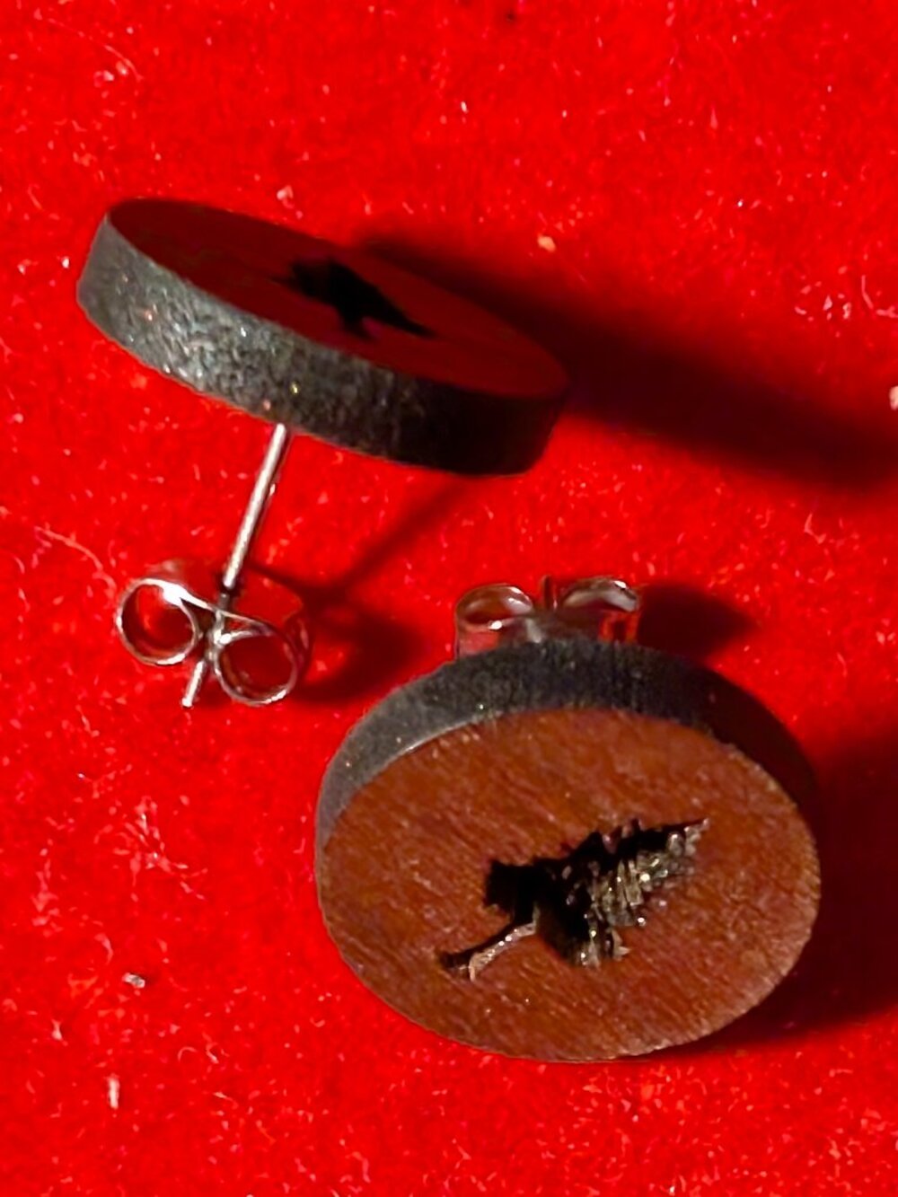 handmade wooden stud earrings featuring a carved pine tree design